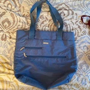 Baggalini tote. Barely used. Like new condition. Makes a nice gift!